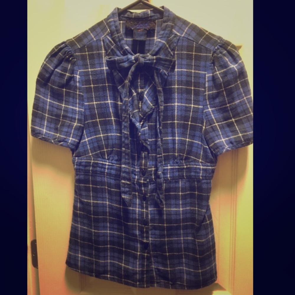 Unique! Flannel button up with cute details!